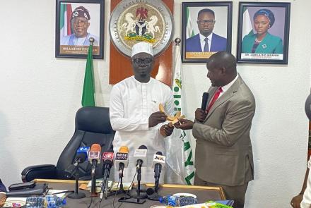 The state minister for Youth receiving an award from the Secretary General AAYC